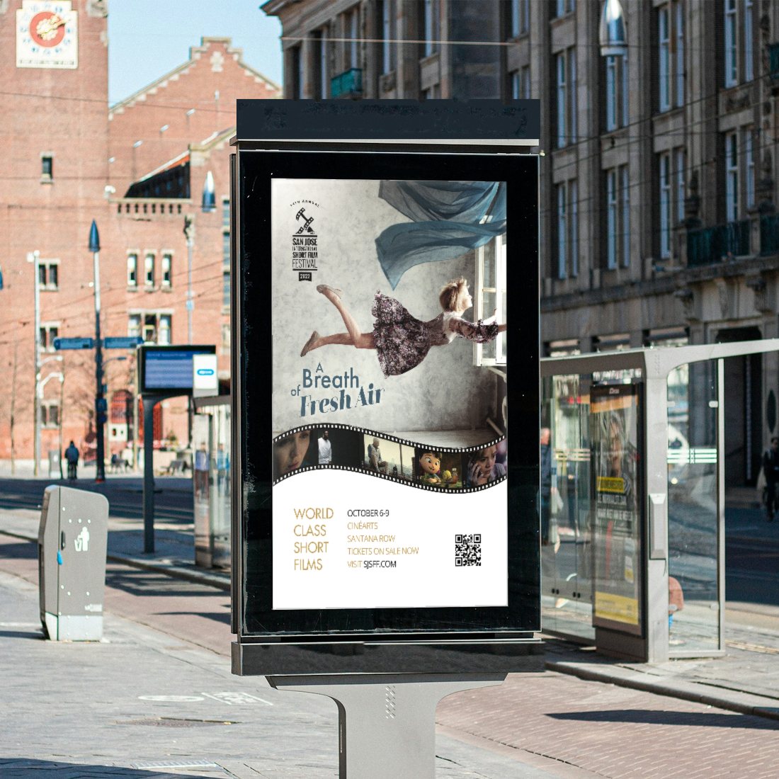 The 2022 San Jose International Short Film Festival “A Breath of Fresh Air” poster in a street ad panel on a sunny city plaza