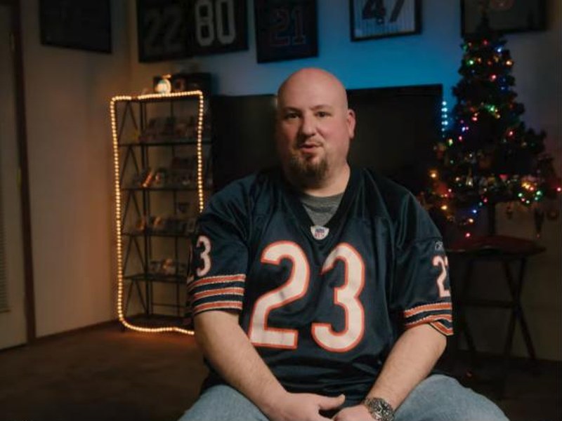 Collector Joshua Morris in a Chicago Bears jersey in In Search of Boozers and Schmucks