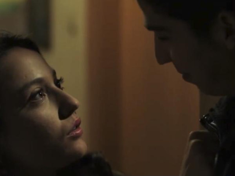 A young couple in a dim hallway in The Criminals