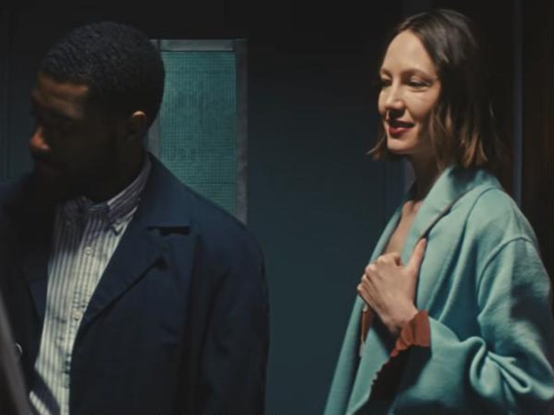 A man and a woman in an elevator in The Diamond